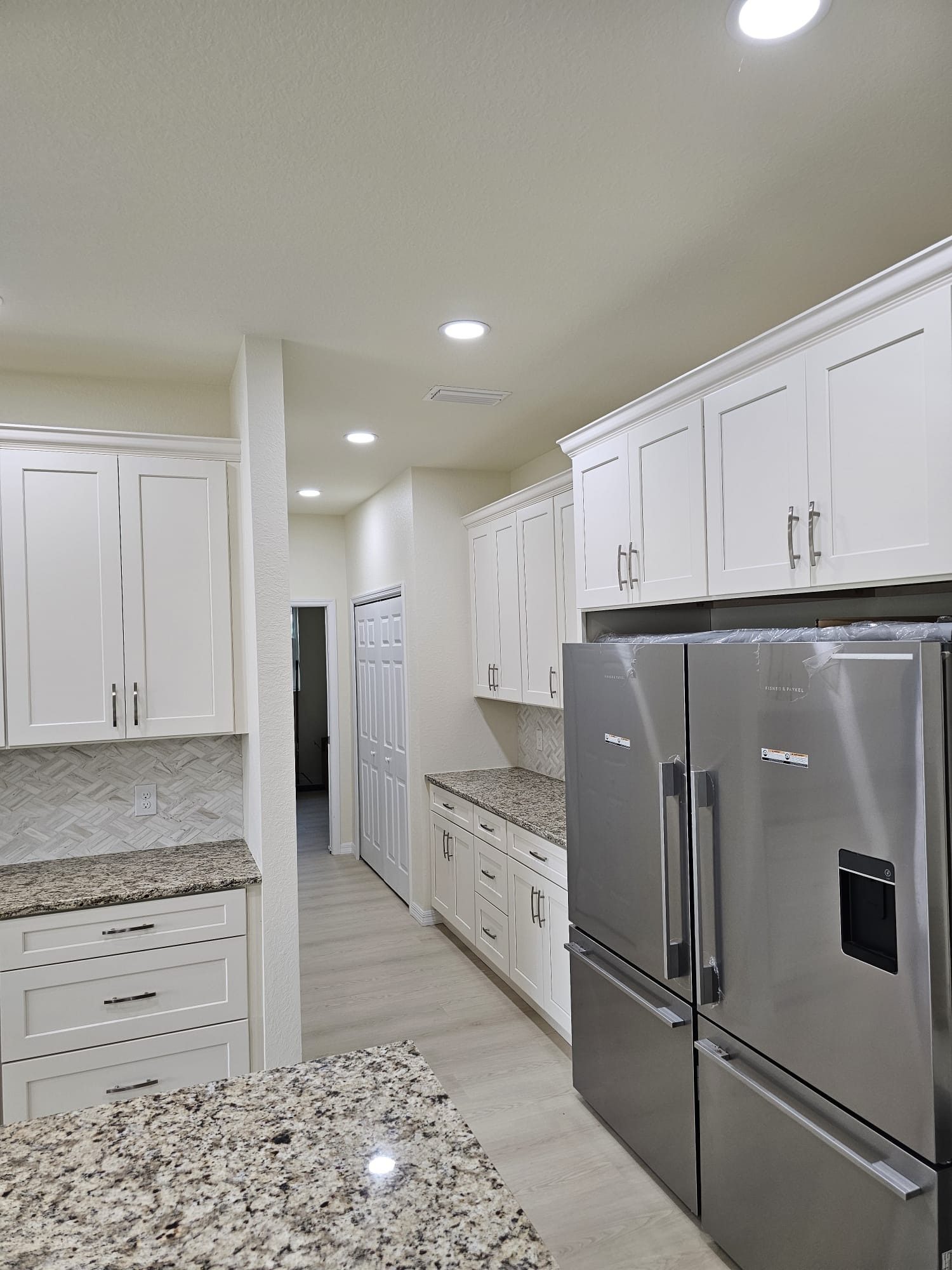 White Kitchen with Stainless Appliances