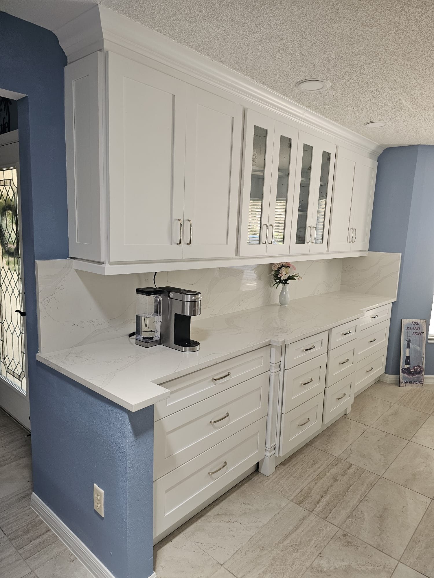 White Kitchen with Glass Uppers and Coffee Station