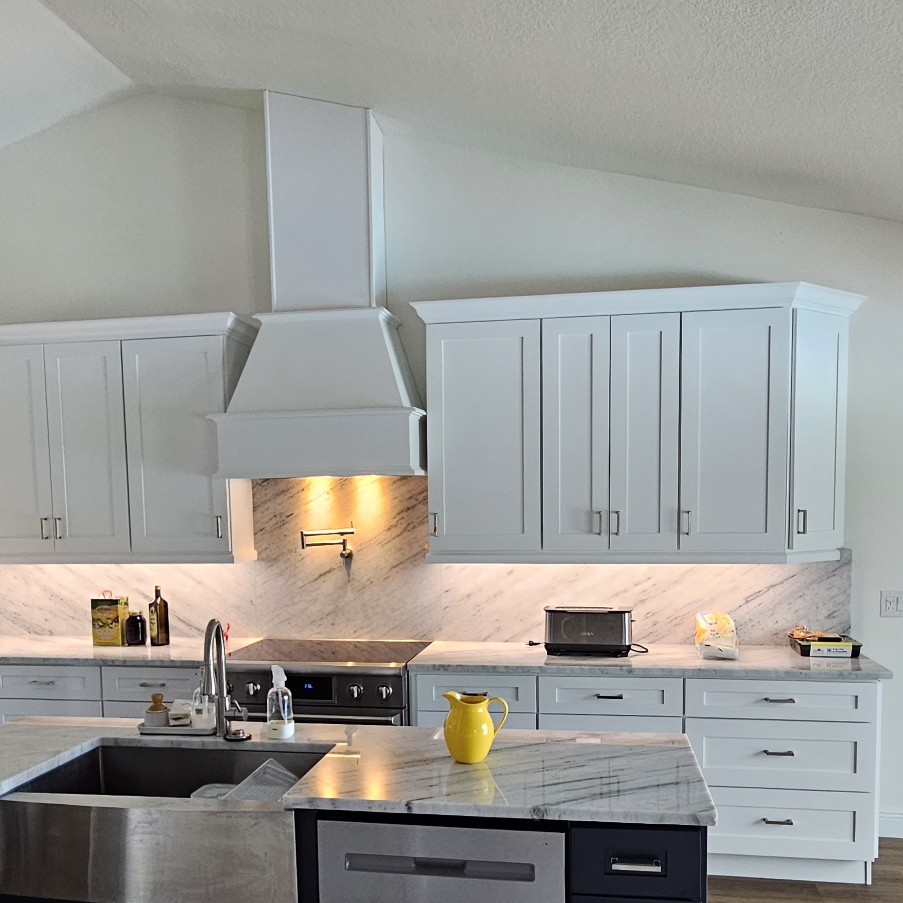 St Charles wood range hood above a cooking area